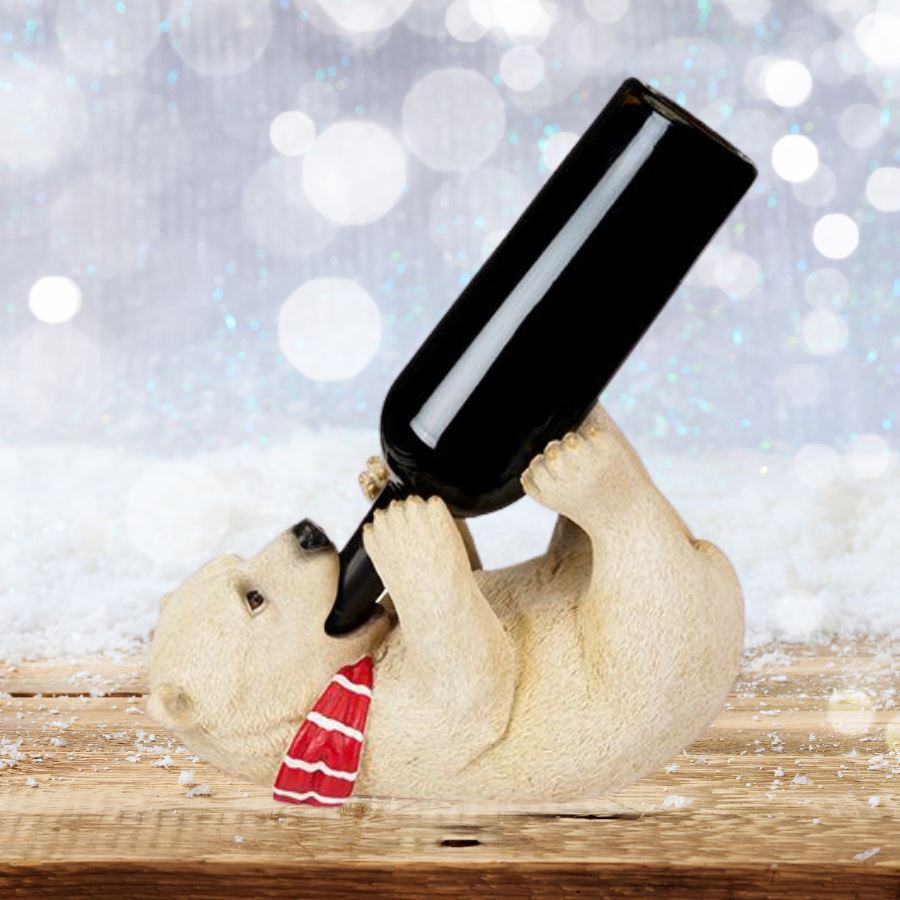 Cozy Cub Wine Bottle Holder - cub holding wine bottle in mouth on table with snowy background