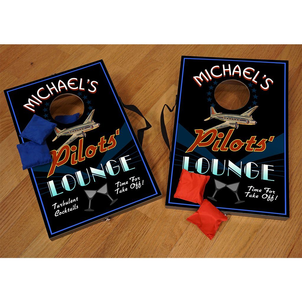 Custom Pilots' Lounge Mini Corn Hole Set with blue and red bean bags on wood background