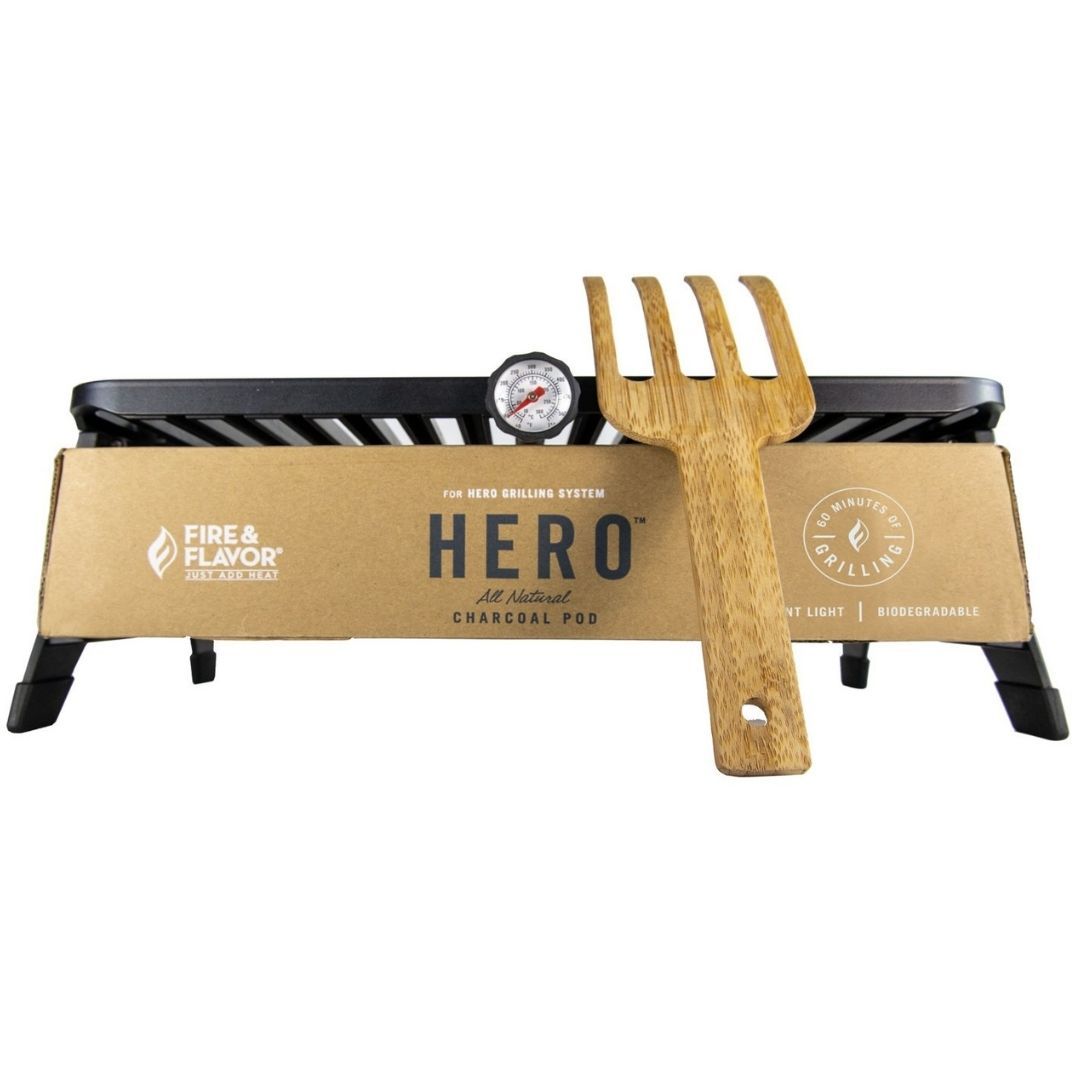 Hero Grill Kit displayed on white background with wooden grill fork leaned against grill